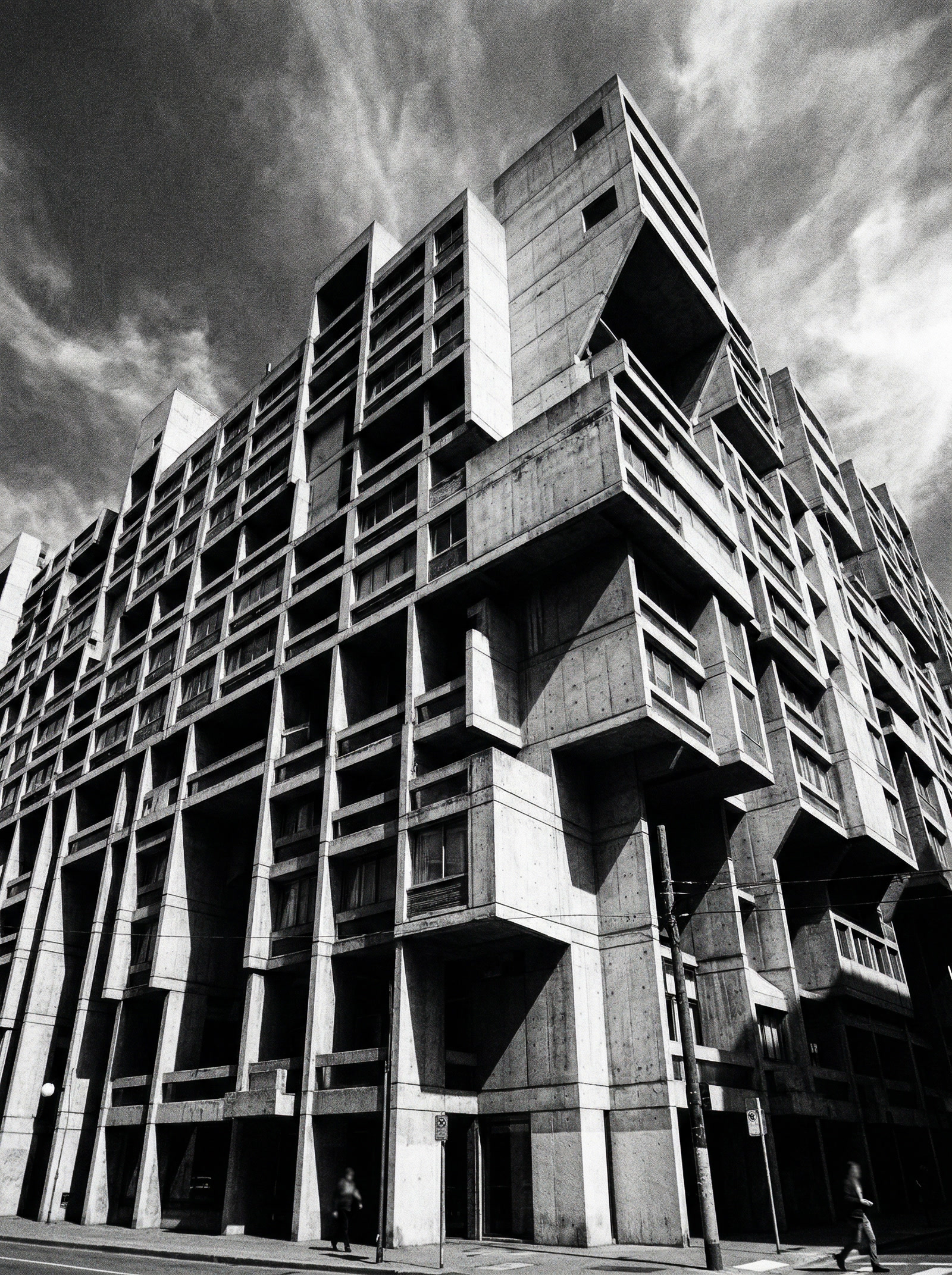 Brutalist concrete building facade with dramatic geometric forms