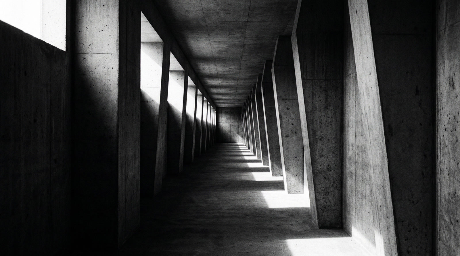 Brutalist concrete corridor with dramatic light and shadow